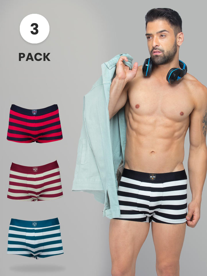 Man wearing striped boxer briefs with three-pack option displayed on gray background