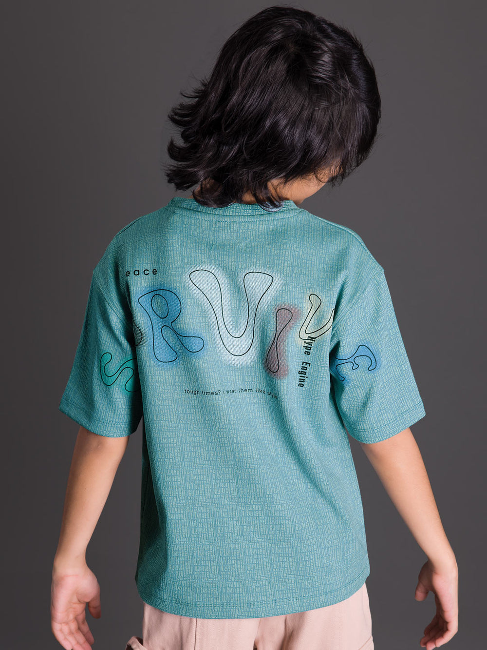 Back view of a boys oversized drop shoulder round neck graphic t-shirt