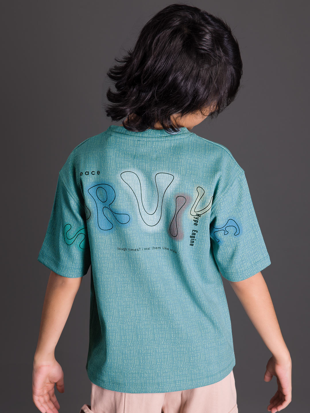 Back view of a boys oversized drop shoulder round neck graphic t-shirt