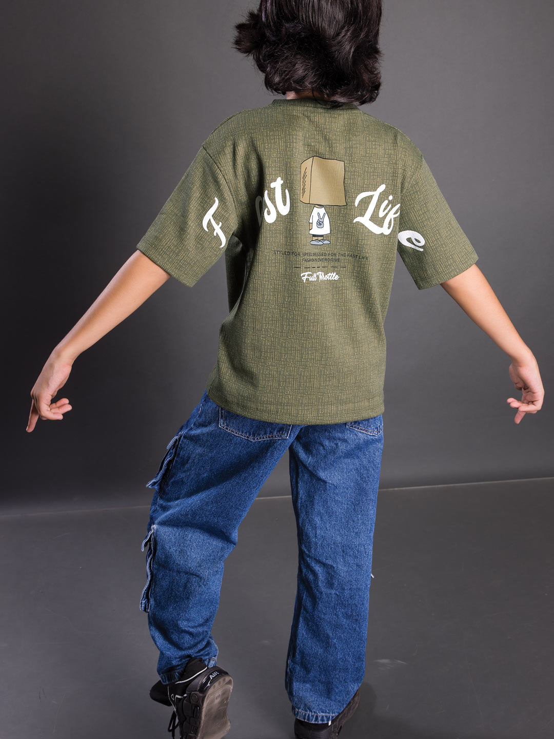 Back view of a boys oversized drop shoulder round neck graphic t-shirt