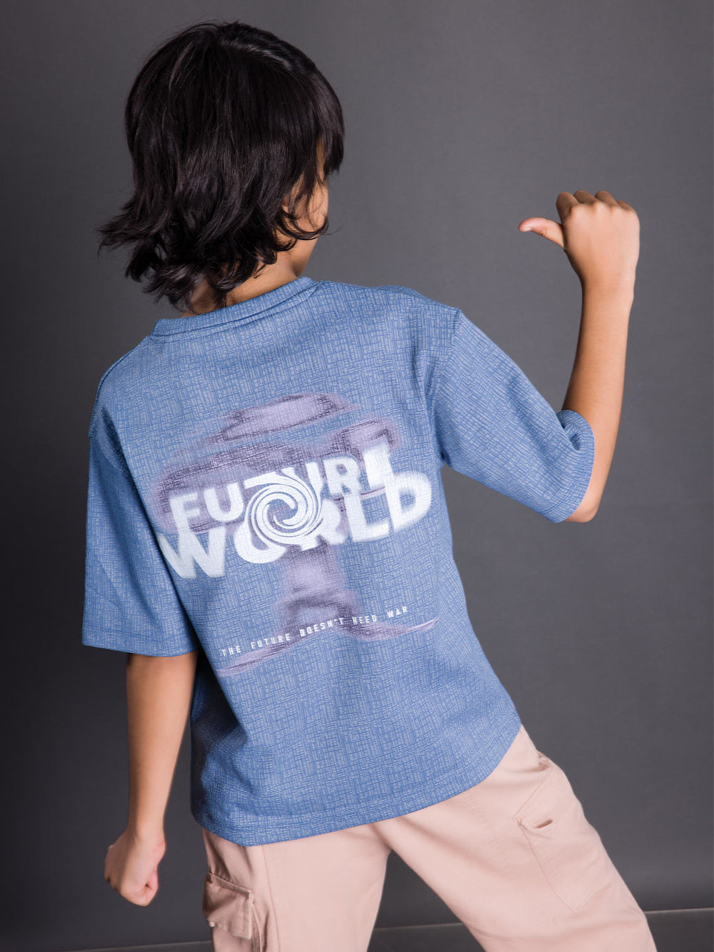 Back view of a boys oversized drop shoulder round neck graphic t-shirt
