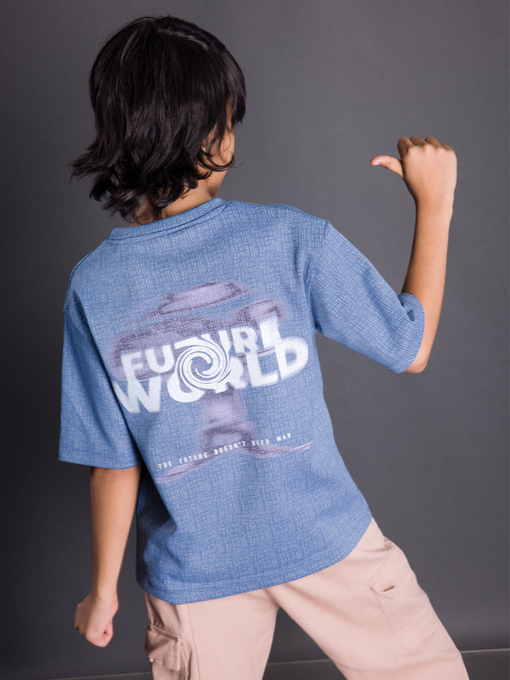 Back view of a boys oversized drop shoulder round neck graphic t-shirt