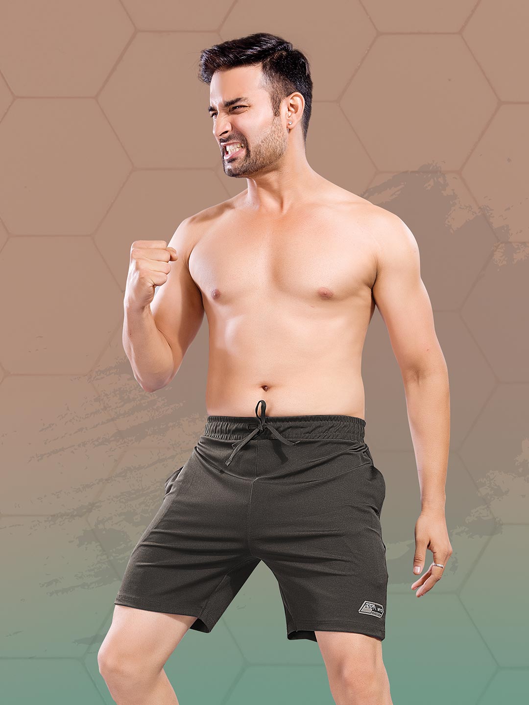 Man wearing black shorts on a gradient background