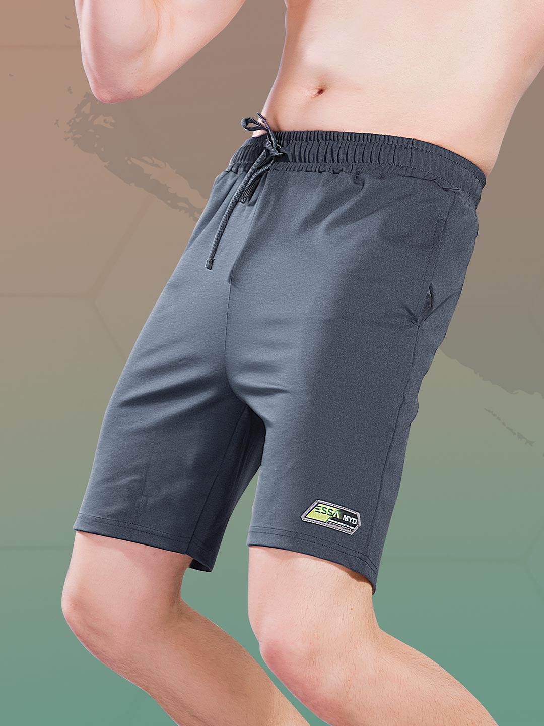 Gray shorts with a brand logo on a gradient background