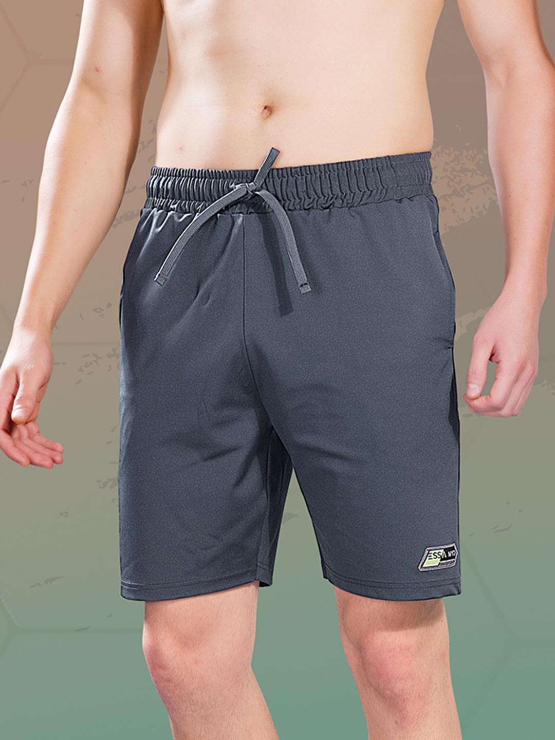 Dark gray shorts with a brand logo on a neutral background