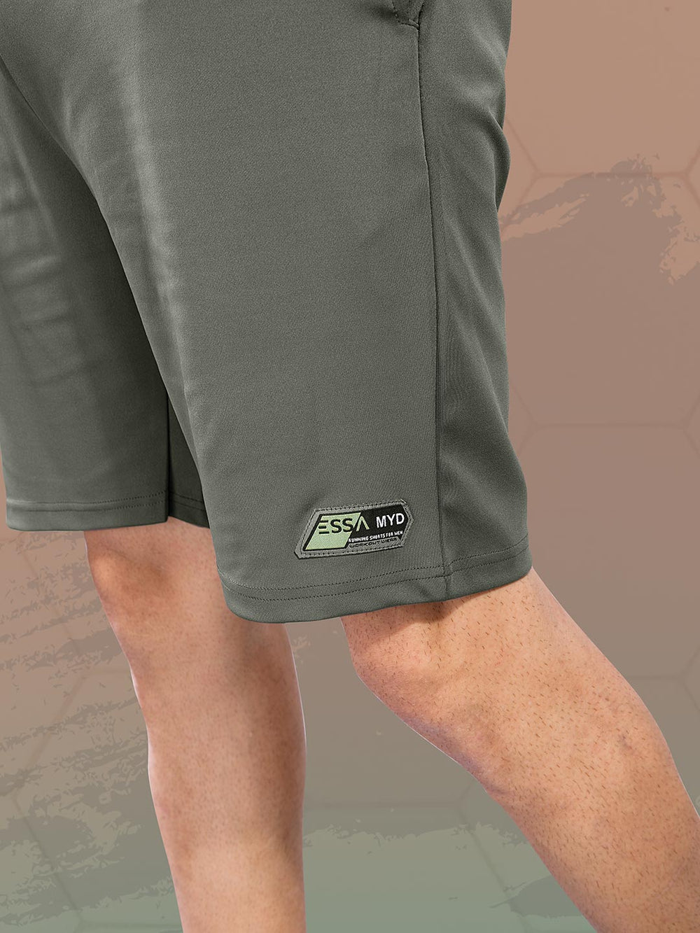 Green shorts with a brand logo on a camouflage background