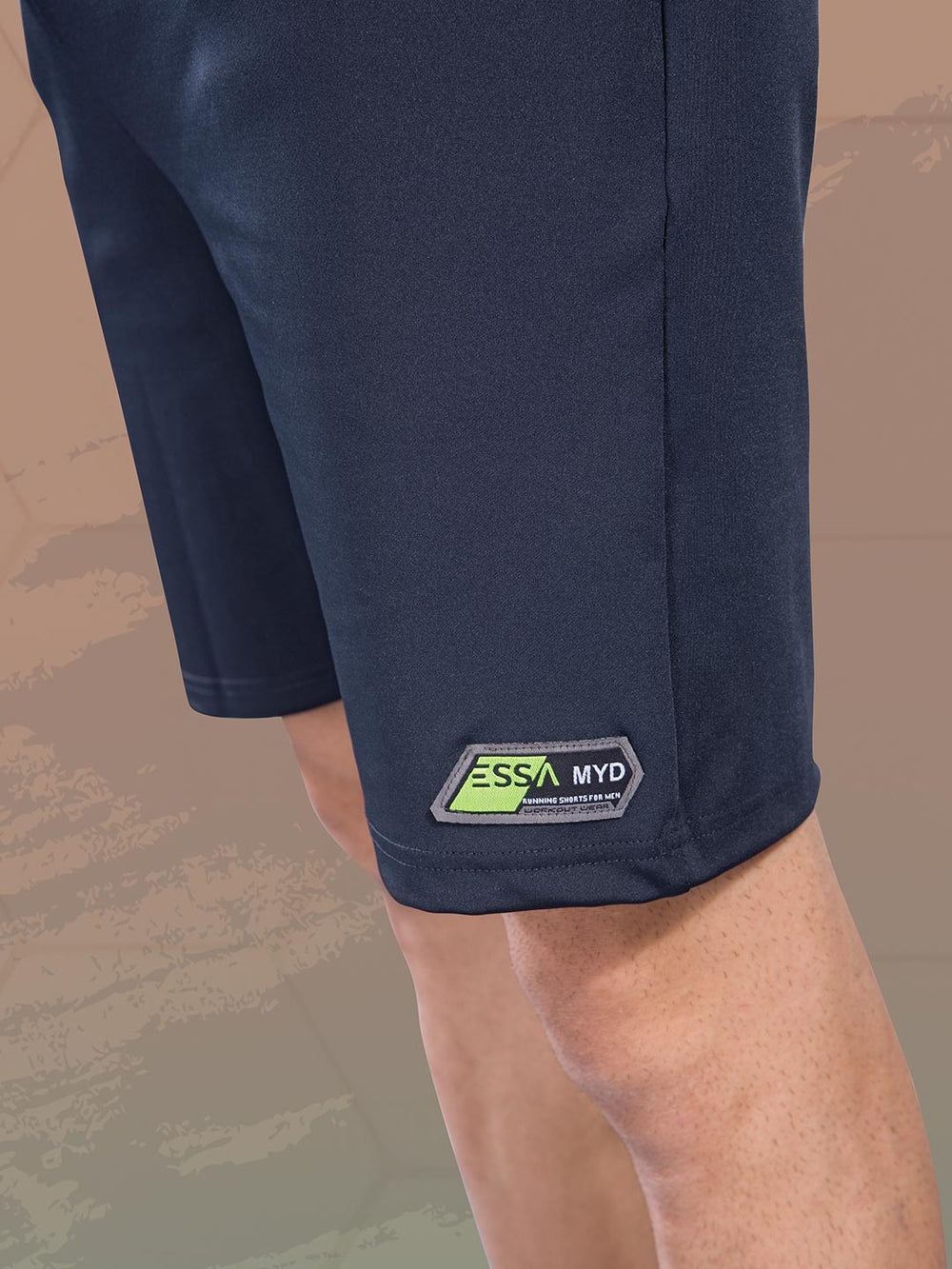 Navy shorts with a visible brand logo on a neutral background