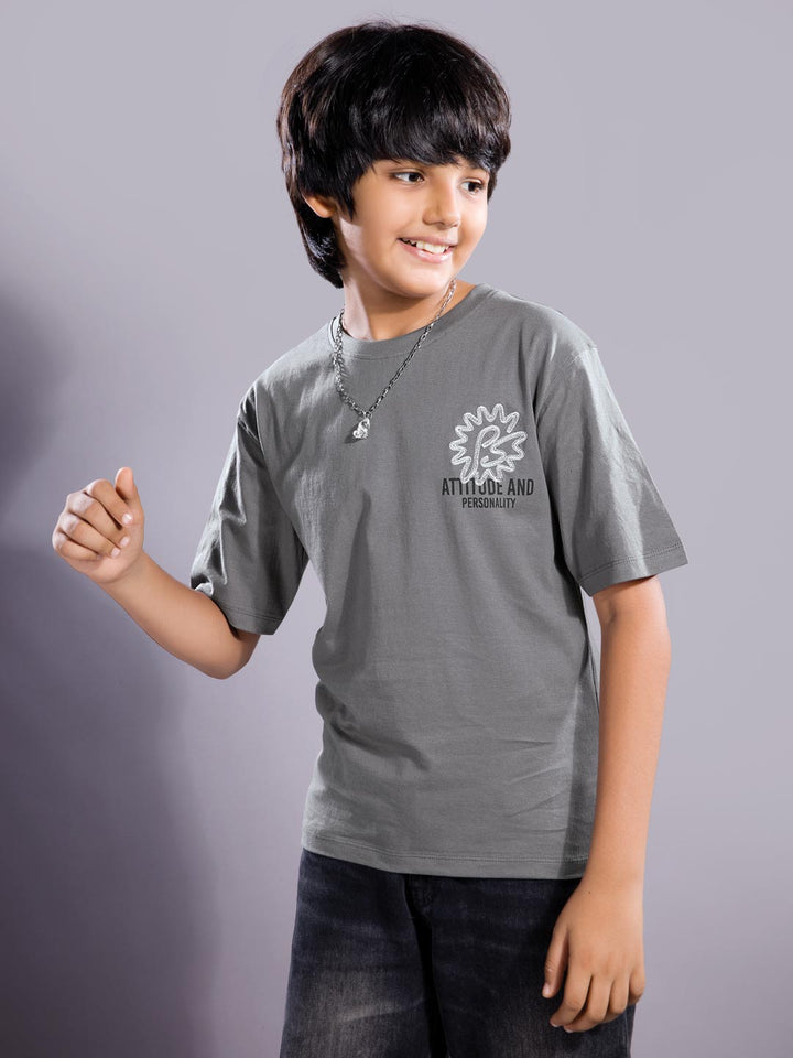 Child wearing a gray t-shirt with a logo on a gray background boys printed down shoulder t-shirt #color_dove-grey