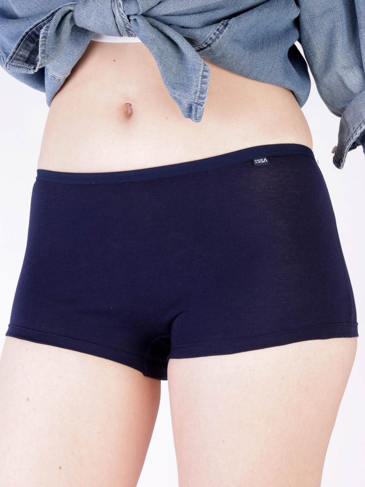 Person wearing navy blue boxer briefs with a denim jacket on a white background #color_mirage