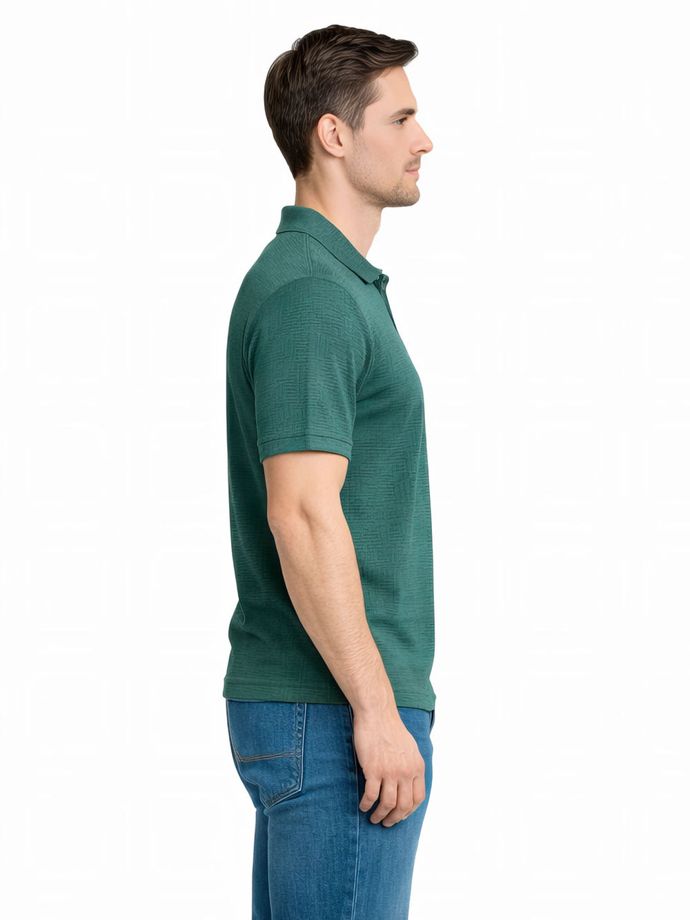 Man wearing a green polo shirt and blue jeans on a white background