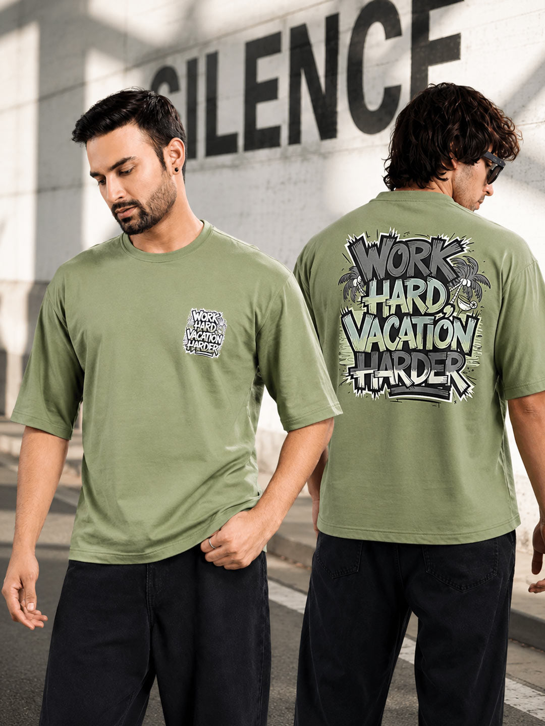 An olive green short-sleeve t-shirt shown on a male model from both the front and back. The front features a small graphic on the left chest, and the back features a large graphic with the text 'WORK HARD VACATION HARDER' in a distressed graffiti-style font.