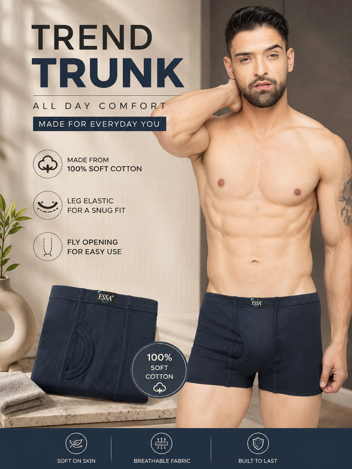 A shirtless male model wearing dark navy blue men's trunk boxer briefs stands beside a matching product display on a stone surface, with promotional text and feature icons on a beige background.color_mirage